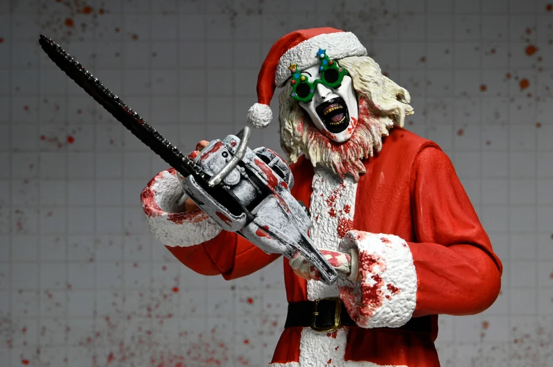 NECA Figura de Accion Ultimate: Terrifier 3 - Santa Suit Art the Clown Bloody Version 7 Pulgadas