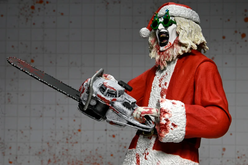 NECA Figura de Accion Ultimate: Terrifier 3 - Santa Suit Art the Clown Bloody Version 7 Pulgadas