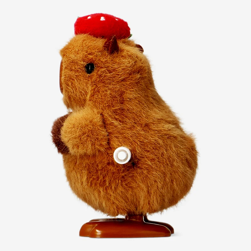 Wind up capybara with strawberry hat