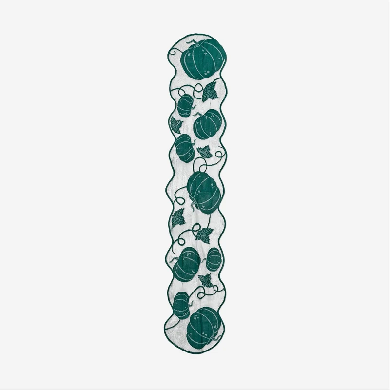Green table runner with pumpkin print