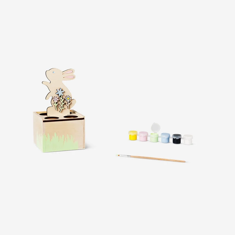 DIY egg stand with paint and brush